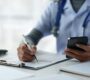 medical transcription services concept doctor typing 90x80